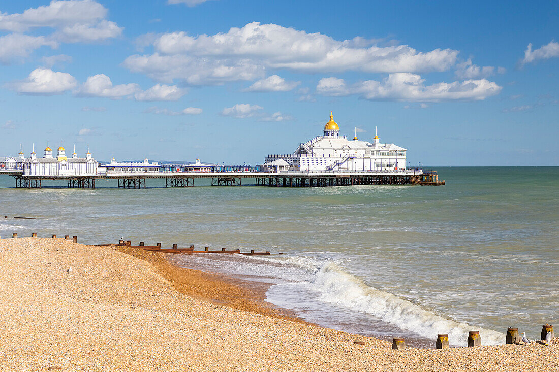 Daylight view of the Eastbourne pier from the shore. Eastbourne, East Sussex, England, United Kingdom.