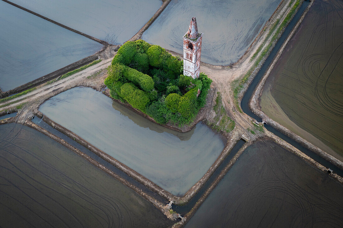 Sunset over the rice fields and abandoned church of Sant'Antonio. Casaleggio di Novara, Novara, Piedmont, Italy.