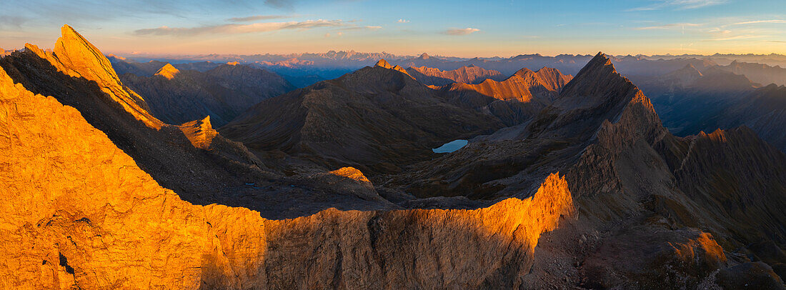 Panoramic and Aerial view of Crete de la Taillante at sunrise during summer, Col Agnel, Alpi Cozie, Cuneo, Provance, Piedmont, France, Italy, Southern Europe