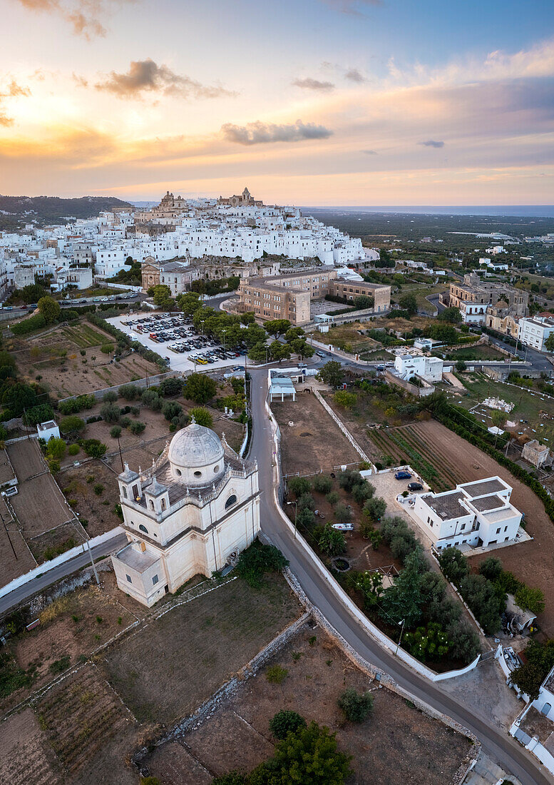 Aerial view of the white town of Ostuni at sunset. Brindisi district, Apulia, Italy, Europe.