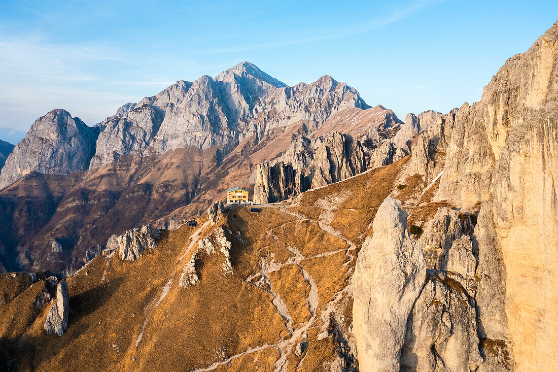 Aerial view of the Rifugio Rosalba and Grigna (Grigna Settentrionale) with Torre Cinquantenario and Torre Cecilia at sunset. Piani Resinelli, Lecco, Lombardy, Italy.