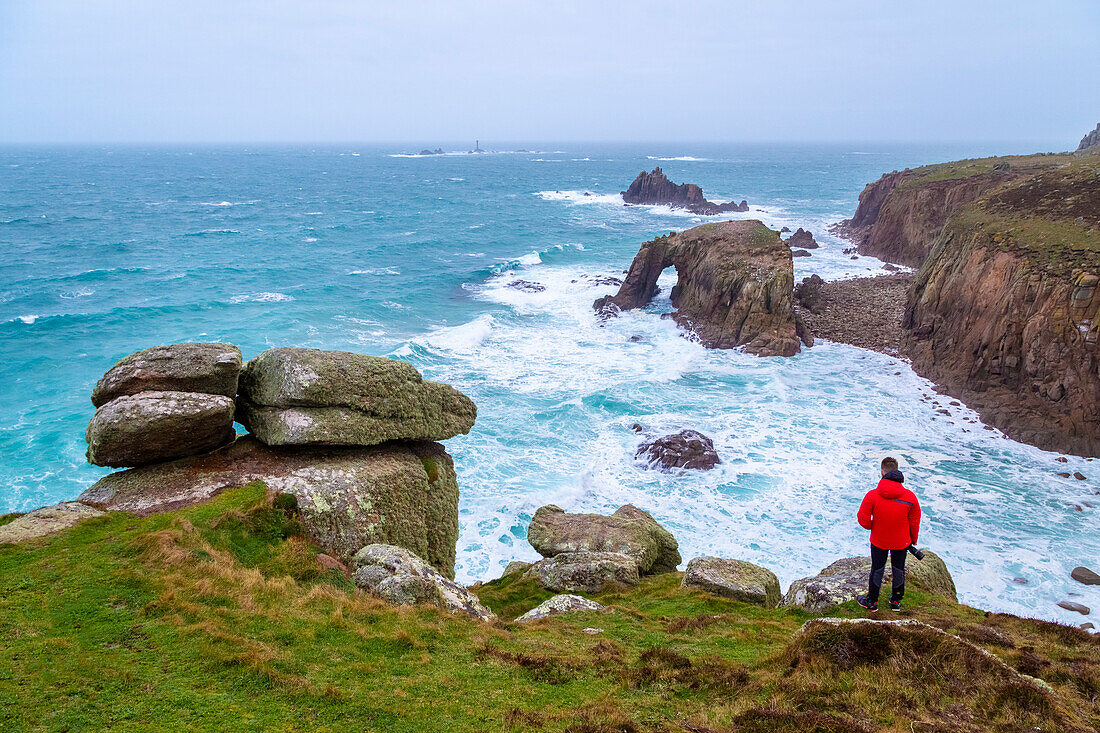 View of the Enys Dodnan Arch at Land's End. Penzance, Western Cornwall, England.