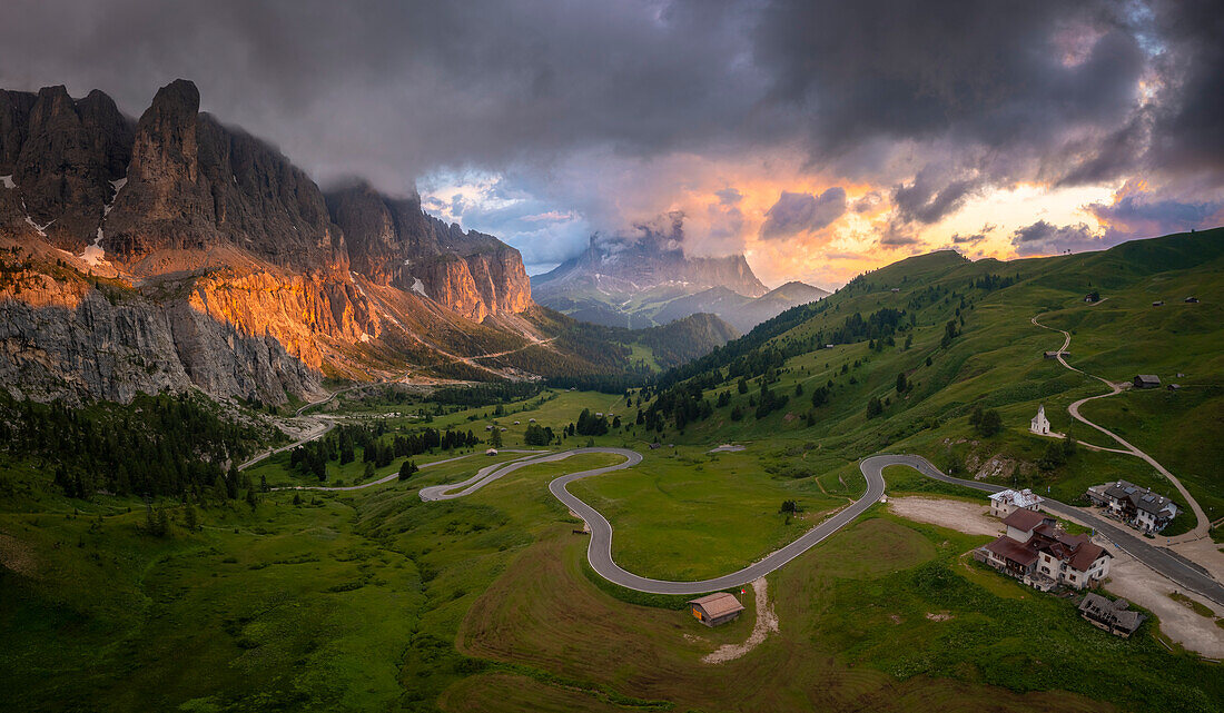 Aerial view of Gardena Pass at sunset after a storm. Dolomites, South Tyrol, Bolzano district, Italy, Europe.