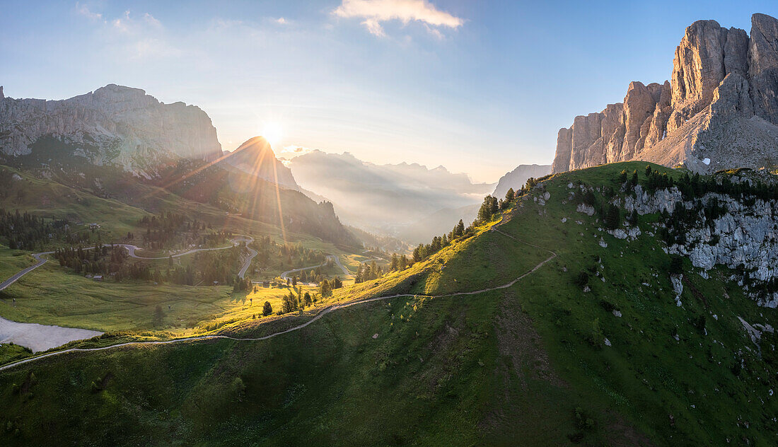 Aerial view of Gardena Pass and Sassongher at dawn. Dolomites, South Tyrol, Bolzano district, Italy, Europe.