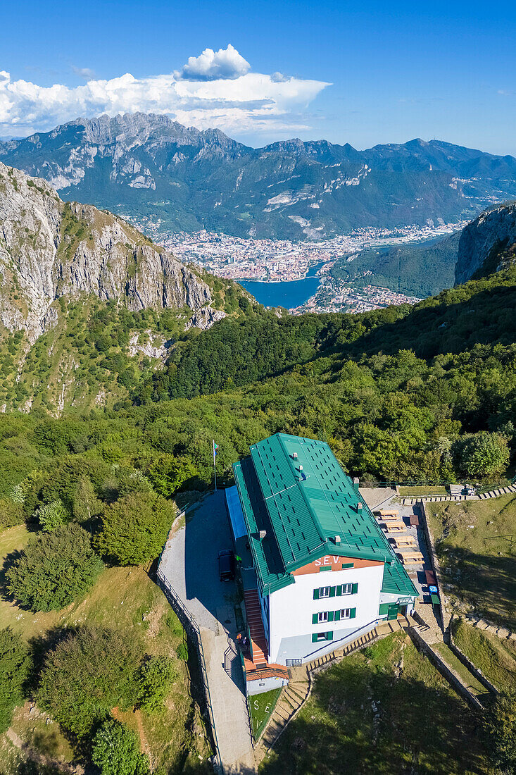 Aerial view of Rifugio Sev dominating on Como Lake (Lecco branch) and located below Corni di Canzo mountains. Valbrona, Como district, Lombardy, Italy, Europe