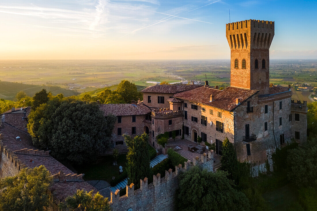 Aerial view of a summer sunset over the Cigognola castle. Cigognola, Oltrepo Pavese, Pavia district, Lombardy, Italy.