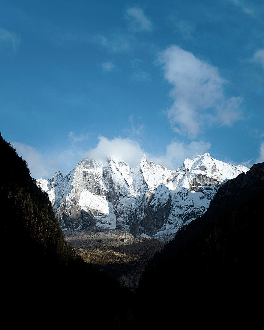 The last light hits the highest peaks of Bregaglia Valley, Canton of Graubunden Switzerland Europe