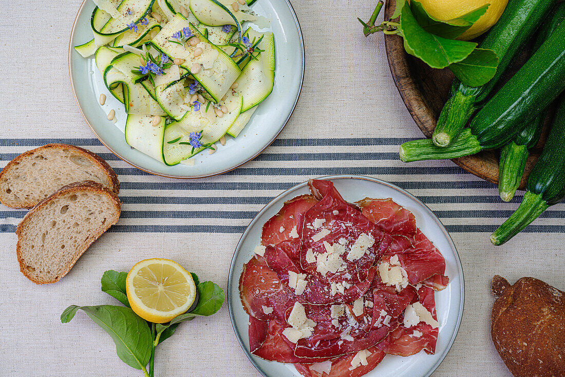 Zucchini carpaccio and bresaola dry-cured meat from Valtellina, Northern Italy