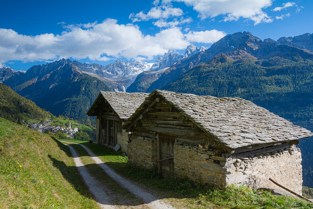 Classic postcard from Bregaglia Valley and Soglio with its mountains. Bregaglia, Maloja district, Switzerland, Europe