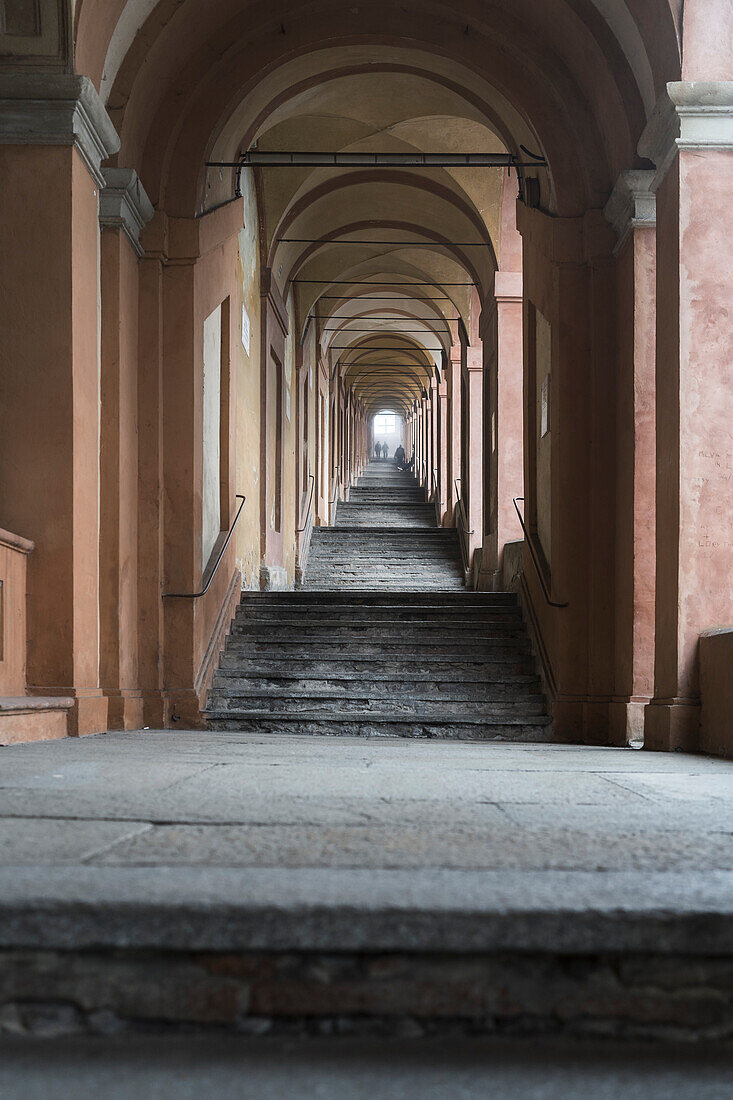 steps and arches of the longest arcade of the world. Bologna, Emilia Romagna, Italy, Europe.