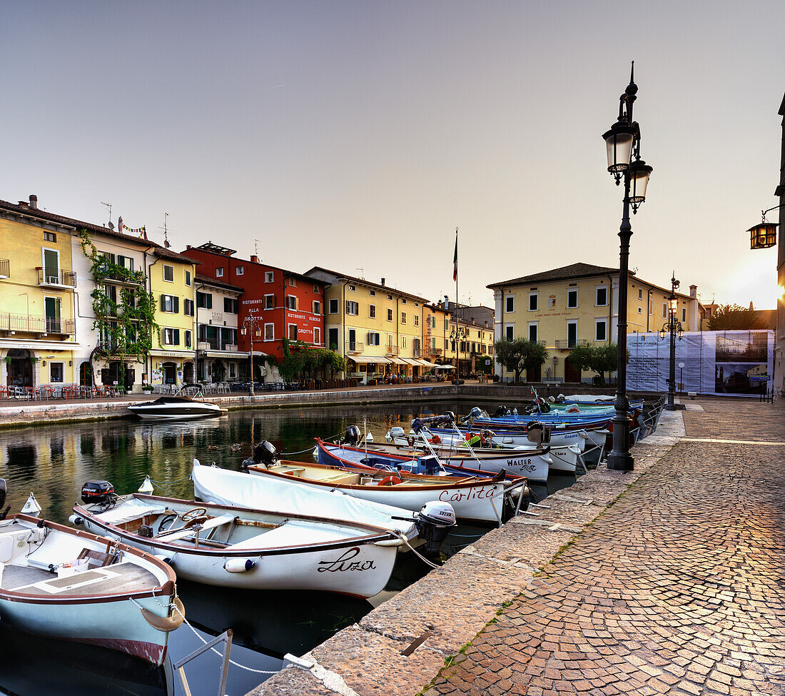 Port of Lazise del Garda, with typical fishing boats, Lazise del Garda, Verona province, Veneto, Lago di Garda