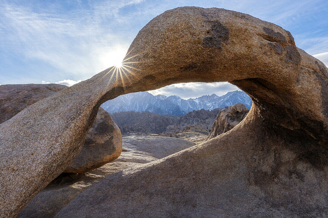 USA, California: sunburst over the Mobius Arch in the Alabama Hills