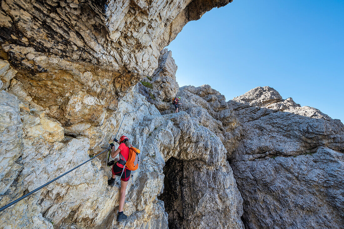 Falzarego Pass, Dolomites, province of Belluno, Veneto, Italy. Mountaineers on the via ferrata "Kaiserjaeger" to the Mount Lagazuoi