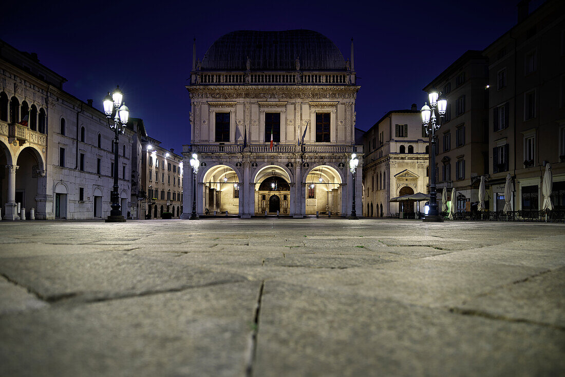 Loggia square in historical center of Brescia, photographed from below during the night illuminated Brescia, Lombardy, Italy, Europe