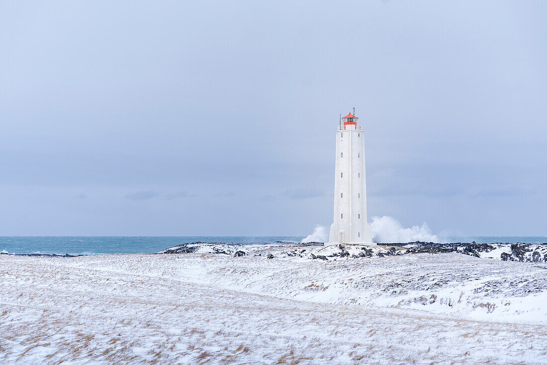 Europe, Iceland: Malarrif Lighthouse and the stormy waves hitting the Snaefellsnes peninsula shore