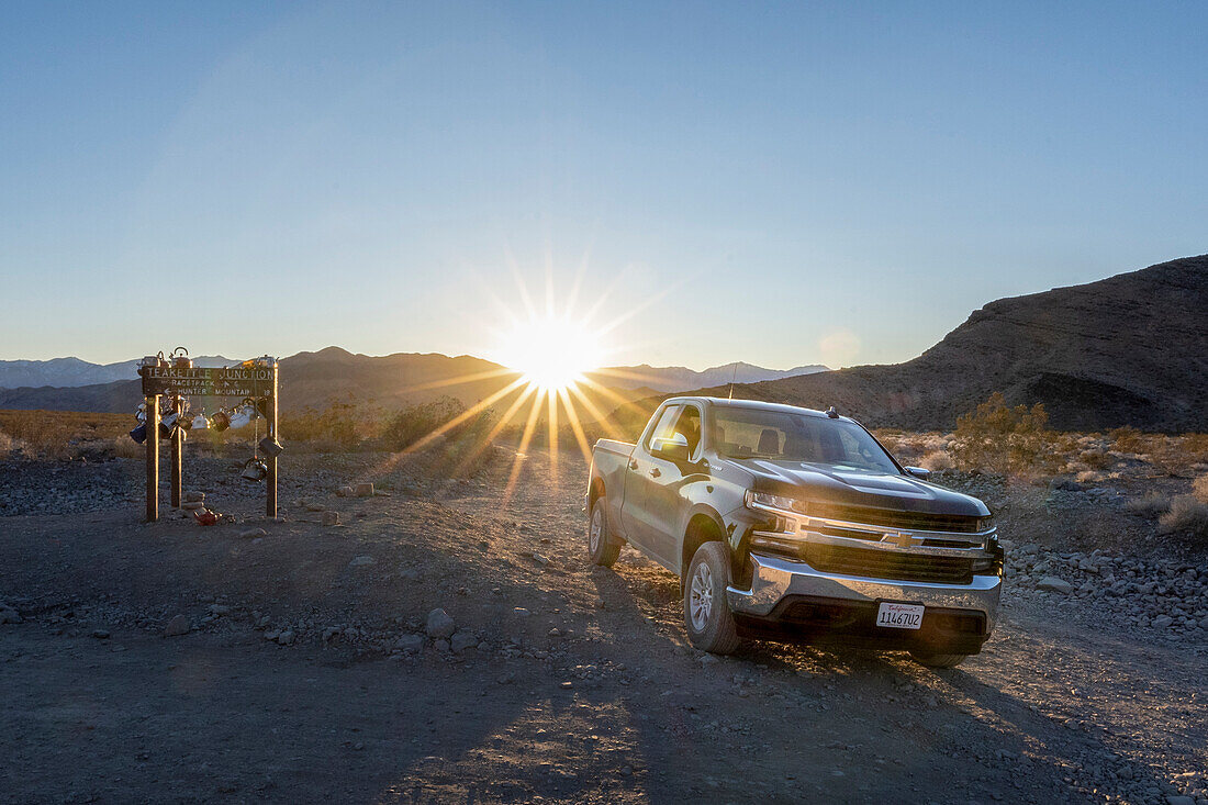 Chevrolet Silverado at Teakettle Junction, an iconic point in the far wilderness of the desert; North America, USA, California, Death Valley National Park