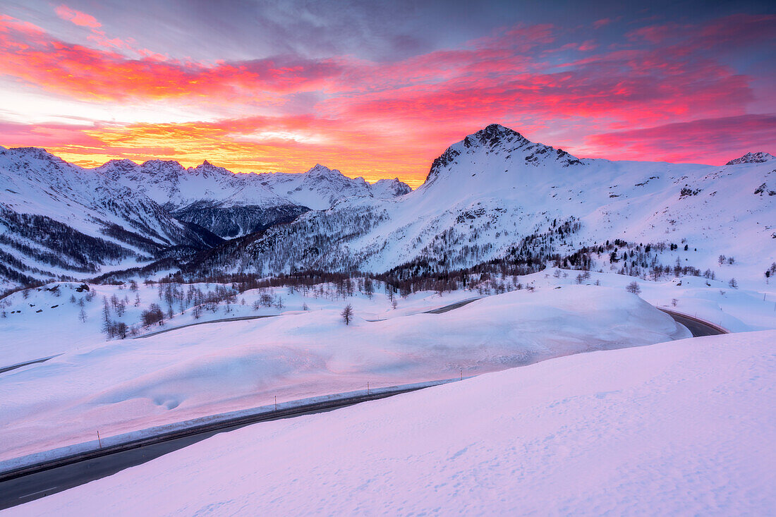 Sunrise over road of Benrinapass in Canton Grigioni, Switzerland, Europe.