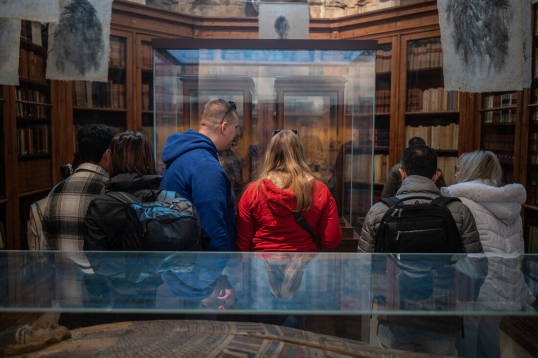 Visitors surprised with mummy of a girl and a boy at The Carmo Archaeological Museum (MAC), located in Carmo Convent, Lisbon, Portugal