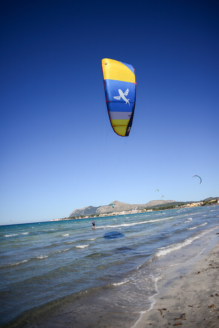 Kitesurfing in Port de Pollenca beach, Mallorca, Spain