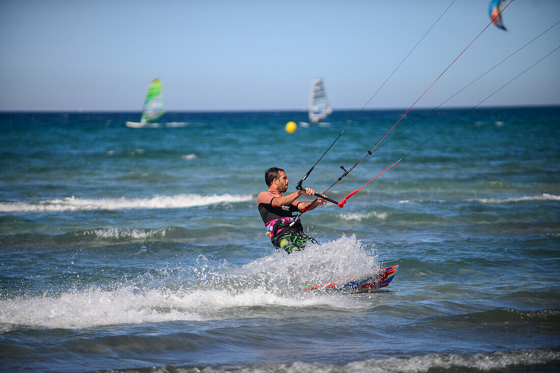 Kitesurfing in Port de Pollenca beach, Mallorca, Spain