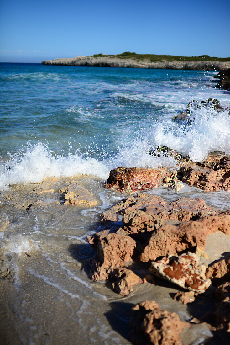 Waves hit the rocks in Cala Varques in Mallorca, Spain