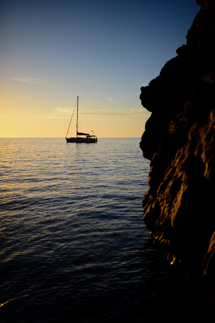 Sailing boat at sunset in Torrent de Pareis, Mallorca, Spain