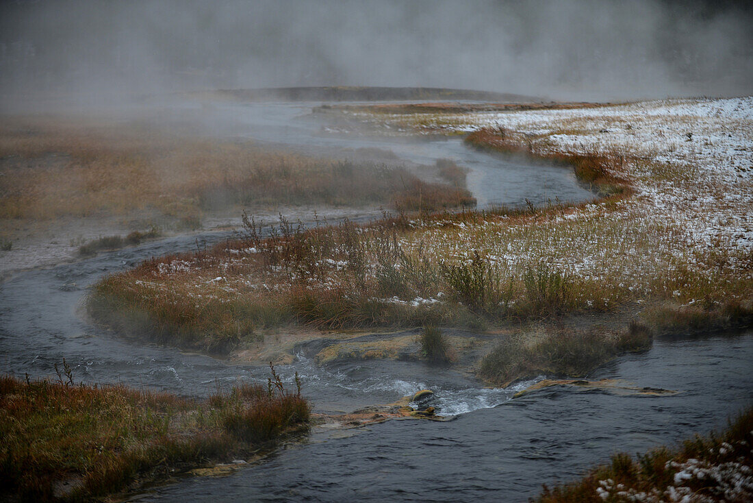 Steam rising from river in Yellowstone National Park, USA