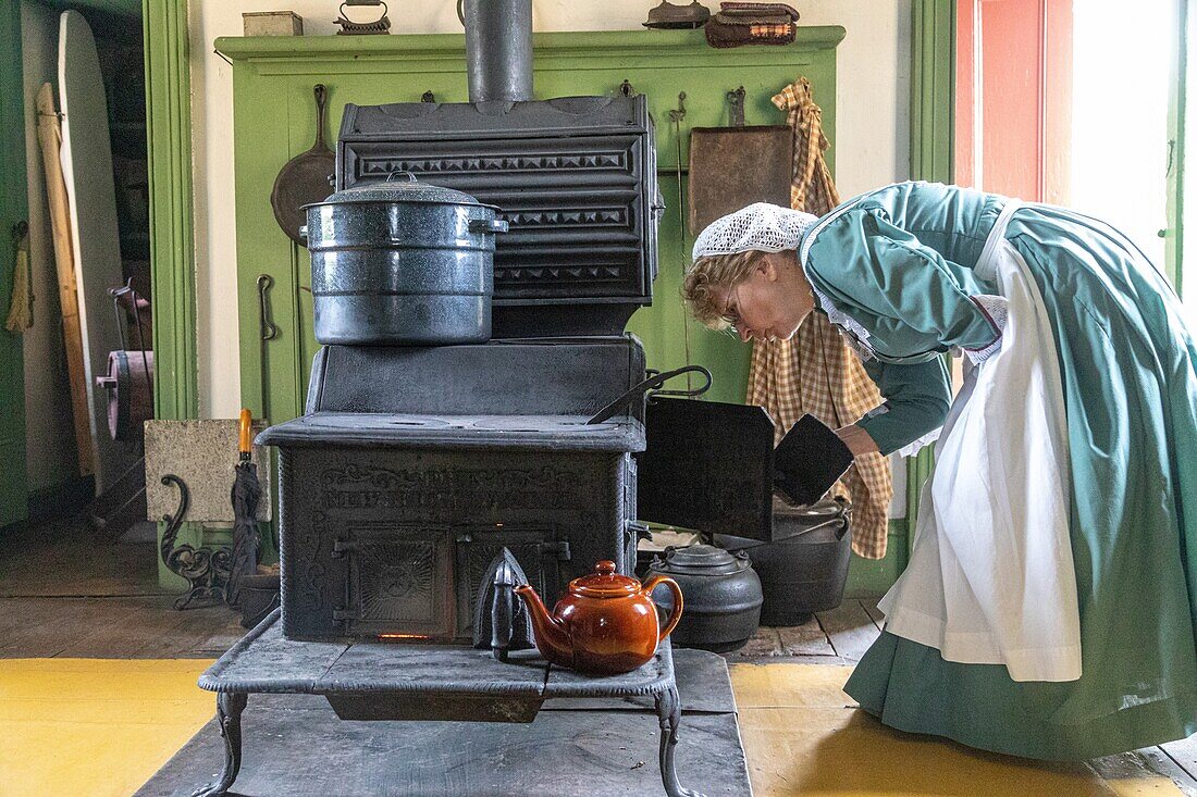 Woman at the stove, perley farm, kings landing, historic anglophone village, prince william parish, fredericton, new brunswick, canada, north america