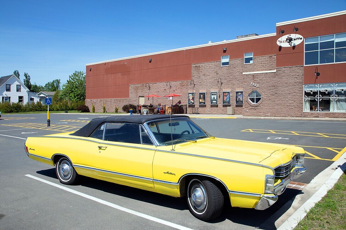 Yellow mercury meteor in front of the jazz a caffe (movie theater), tracadie-sheila, new brunswick, canada, north america