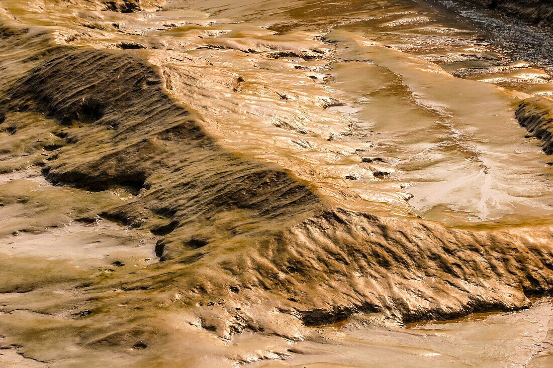 Mountain of silt on the riverbed, the saugeron at low tide, lunar landscape, blaye, gironde, france