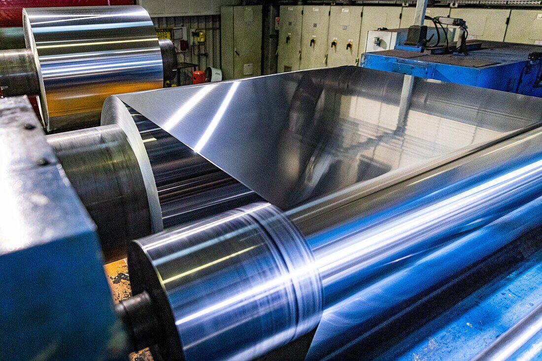 Flattening of the metal, spool of aluminum in a calender, eurofoil factory, company specializing in aluminum metallurgy, rugles, eure, normandy, france