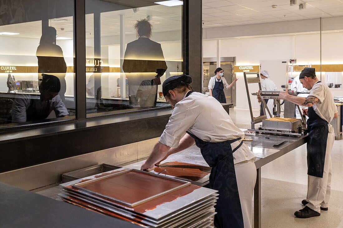 The making of chocolate in front of the visitors at the cluizel chocolate factory, damville, mesnil-sur-iton, eure, normandy, france