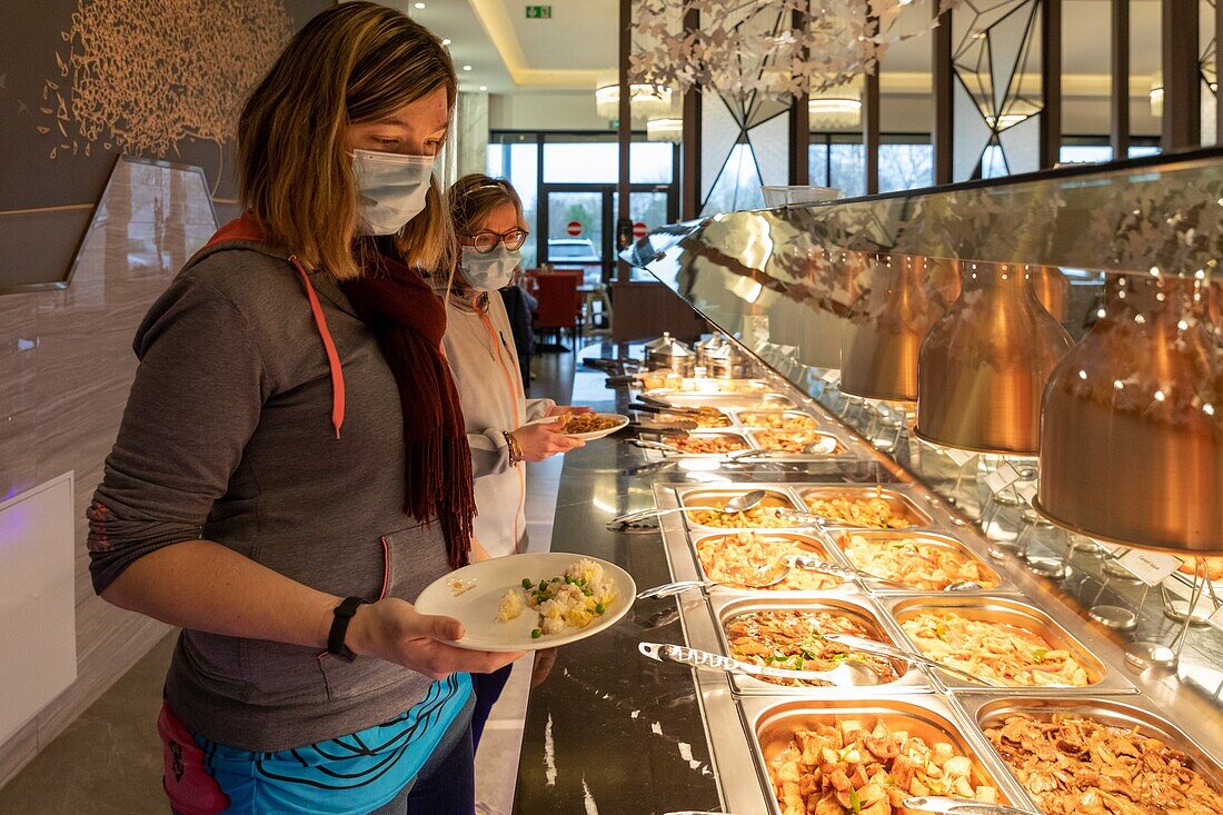 Autonomous residents in the restaurant, care home for adults with moderate mental disabilities, residence du moulin de la risle, rugles, eure, normandy, france