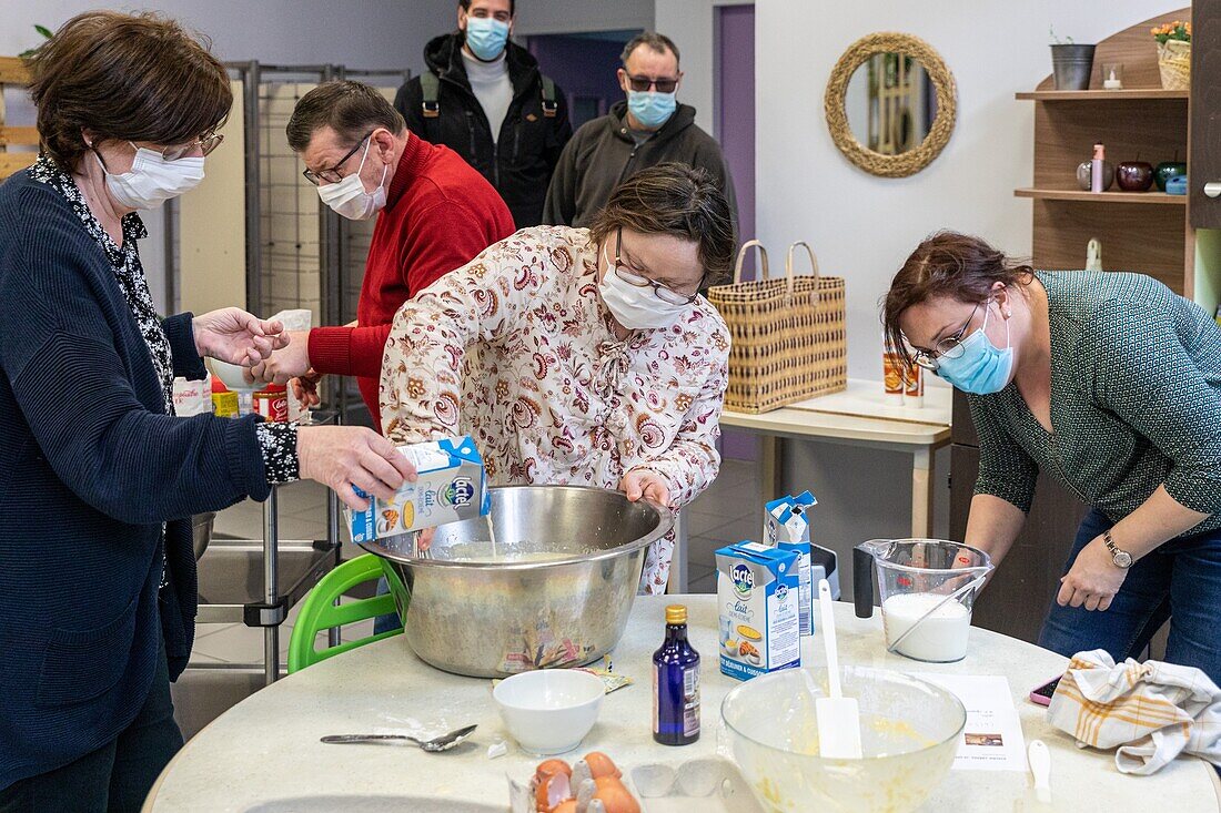 Making crepes with the monitors, care home for adults with mental disabilities, residence la charentonne, adapei27, association departementale d'amis et de parents, bernay, eure, normandy, france