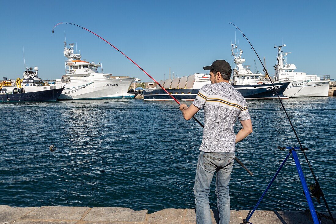 Fisherman on the port, sete, herault, occitanie, france