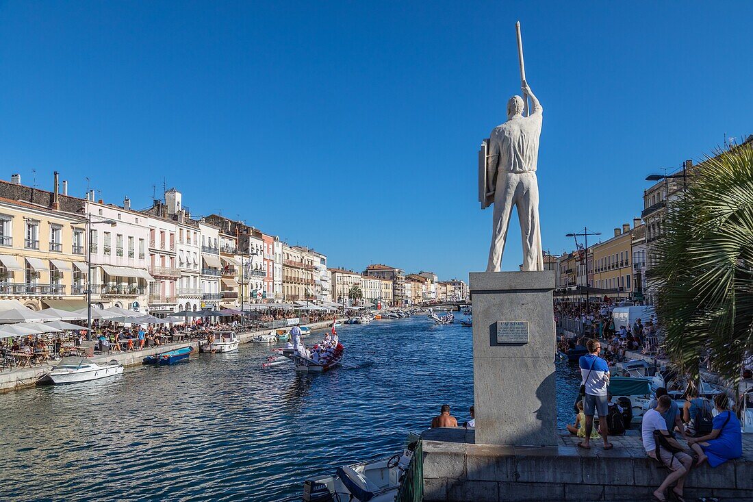 Statue of aurelien evangelisti in front of the canal royal, king of nautical jousts, sete, herault, occitanie, france