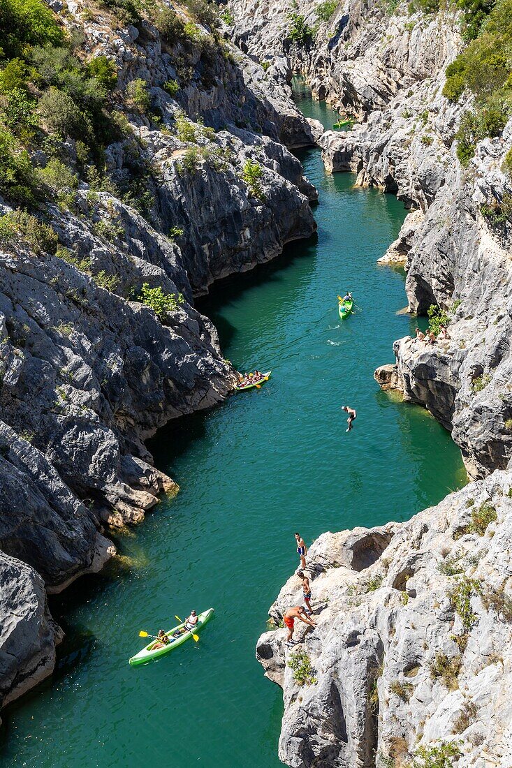 Canoes and bathers, gorges of the herault along the way of saint james, aniane, saint-guilhem-le-desert, herault, occitanie, france