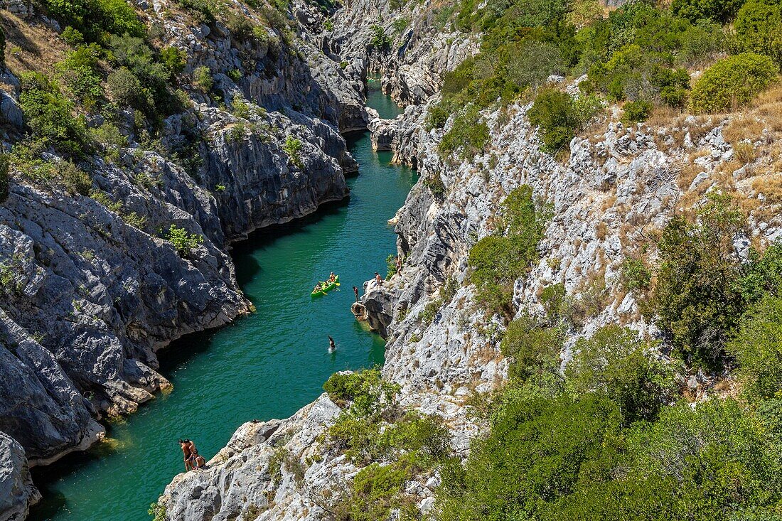 Canoes and bathers, gorges of the herault along the way of saint james, aniane, saint-guilhem-le-desert, herault, occitanie, france