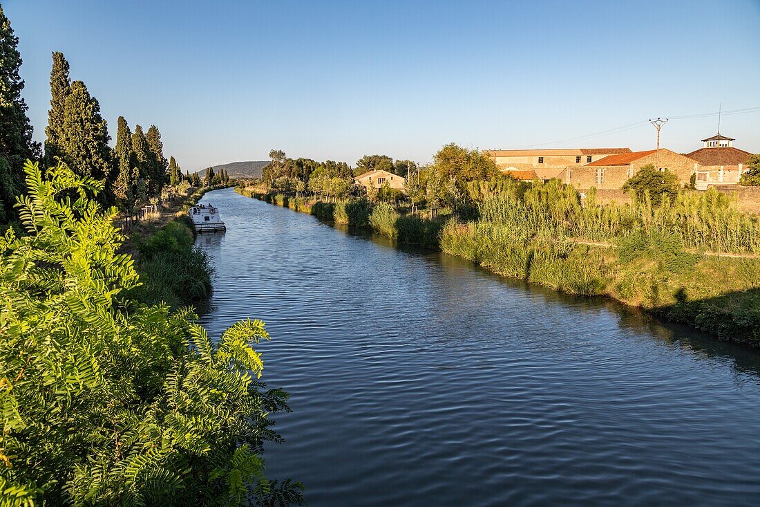 The midi canal near the jouarres lock, azille, aude, occitanie, france