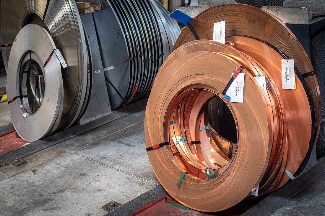 Stock of rolls of copper and steel in the factory, l'aigle, orne, normandy, france