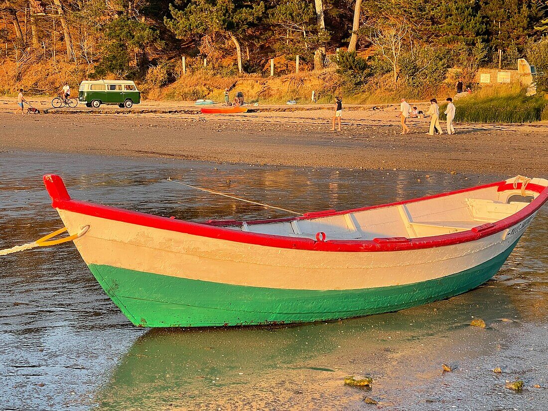 Boat on the seaside and a volkswagen combi, beach of saint-malo, manche, normandy, france