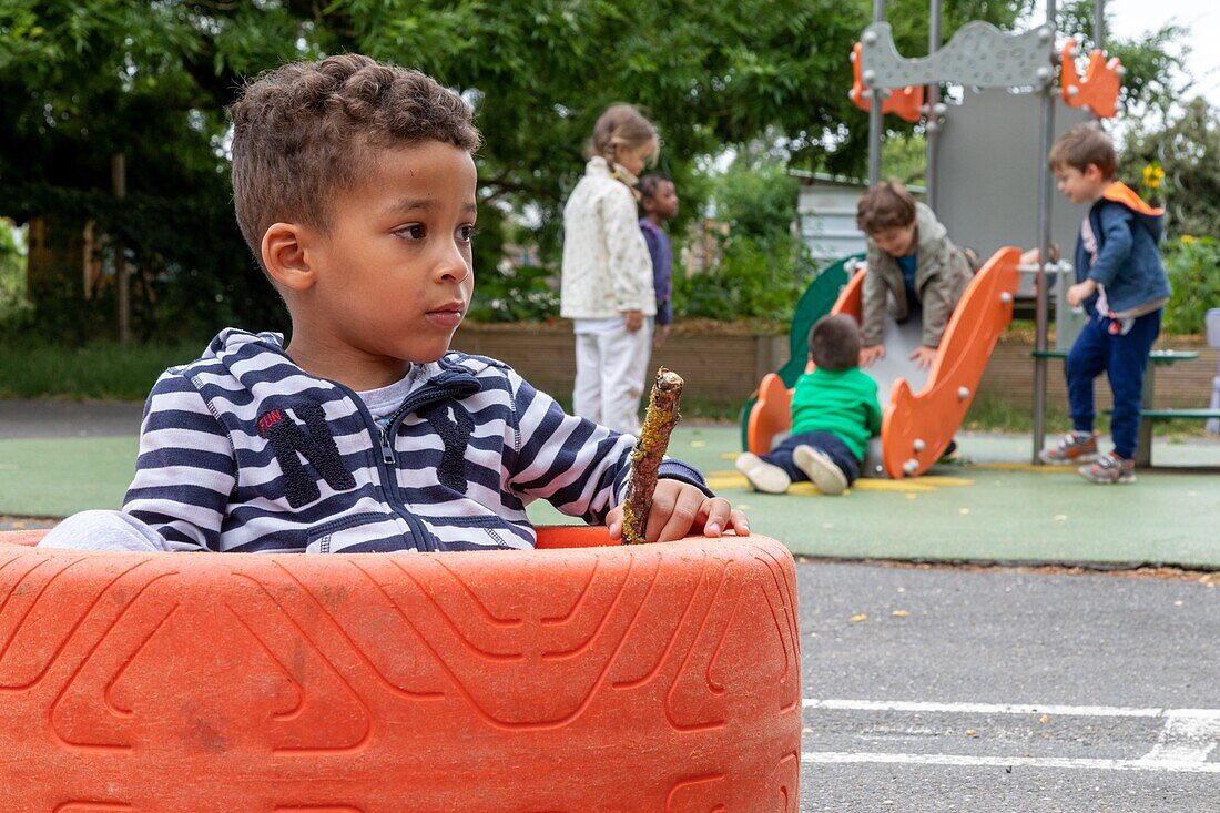 Integration of children with difficulties in the public schools, slight mental disabilities, relaxation and games in the playground, roger salengro kindergarten, louviers, eure, normandy, france