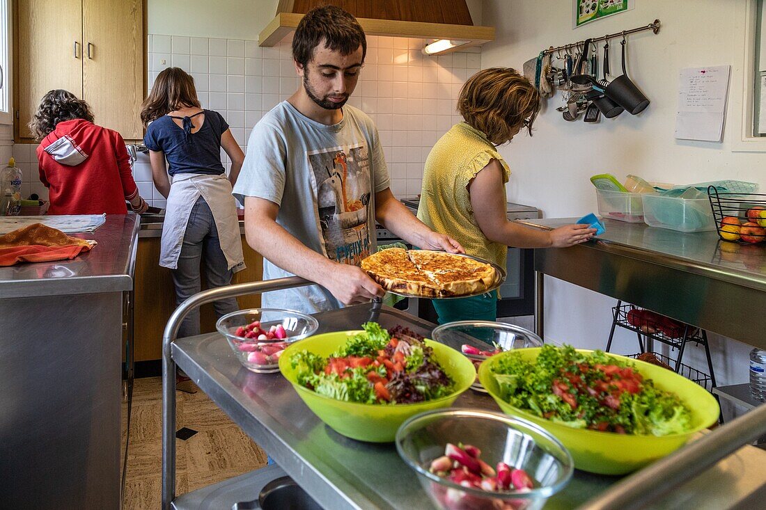 The residents and care workers preparing the shared meal, sessad la rencontre, day care, support and service organization for people with disabilities, le neubourg, eure, normandy, france