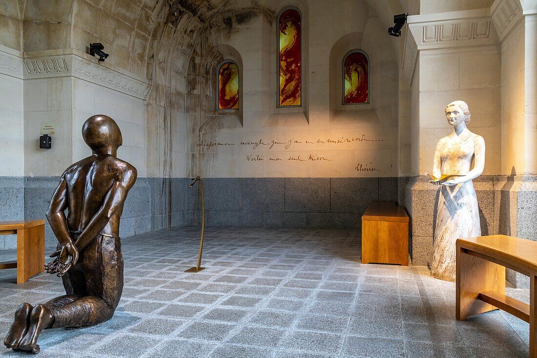 Kneeling in prayer, basilica of sainte-therese of lisieux, pilgrimage site, lisieux, pays d'auge, normandy, france