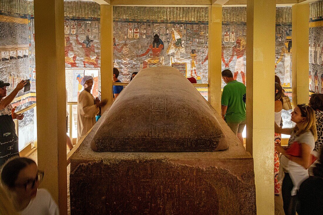 Tourists at the tomb of ramses and frescoes painted in bright colors, tomb of ramses i, valley of the kings where the hypogeum of many pharaohs of the new empire can be found, luxor, egypt, africa