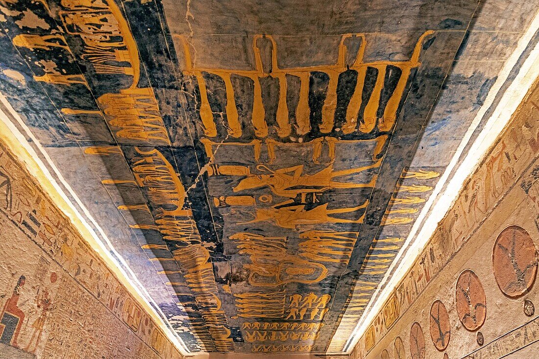 Bas-relief and frescoes painted in bright colors illustrating the book of the caverns, funerary text of ancient egypt, tomb of ramses ix, valley of the kings where the hypogeum of many pharaohs of the new empire can be found, luxor, egypt, africa