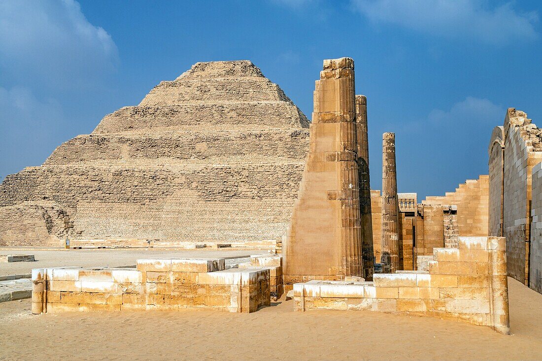 Ruins of the temple and the step pyramid of djoser, the oldest edifice in stone and first pyramid in history, saqqara necropolis from the old kingdom, region of memphis, former capital of ancient egypt, cairo, egypt, africa
