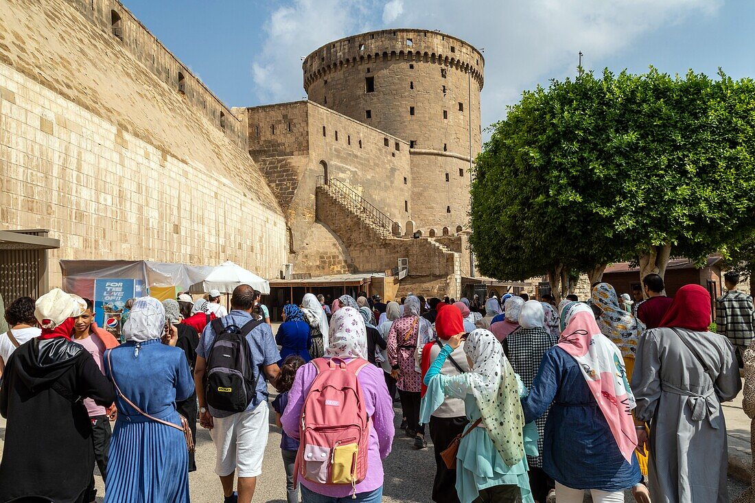 Group of students in front of the saladin citadel, salah el din, built in the 12th century, cairo, egypt, africa