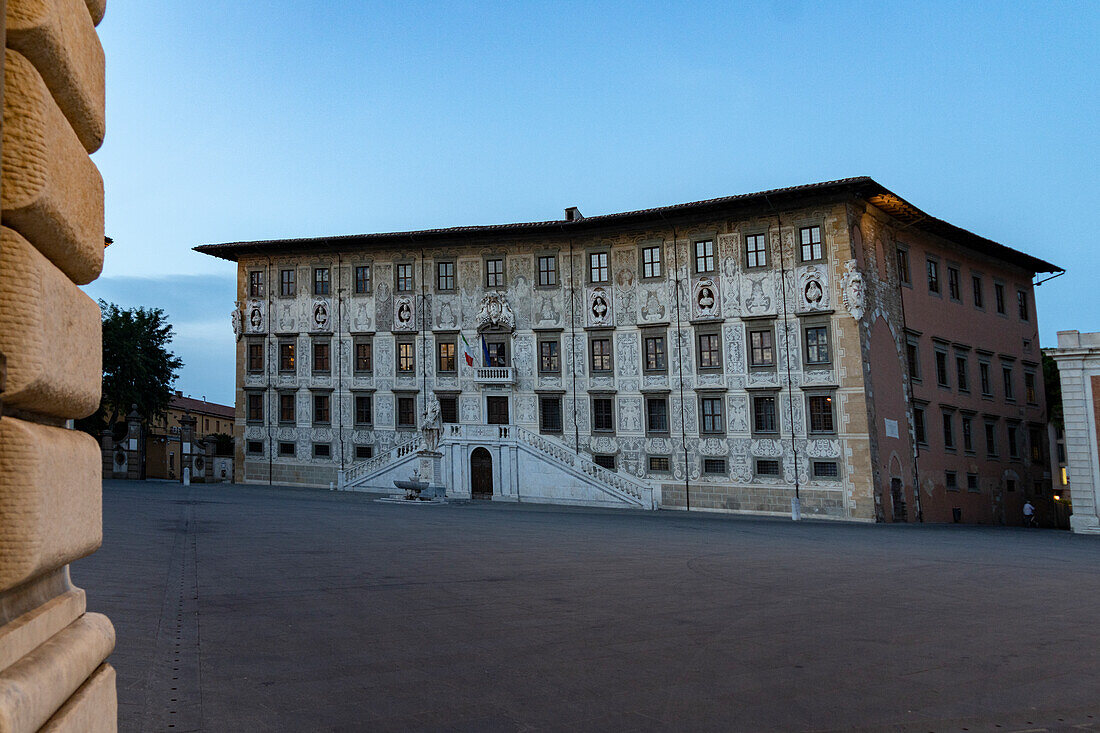 The historic building Palazzo della Carovana at dawn, Piazza dei Cavalieri square, Pisa, Tuscany, Italy