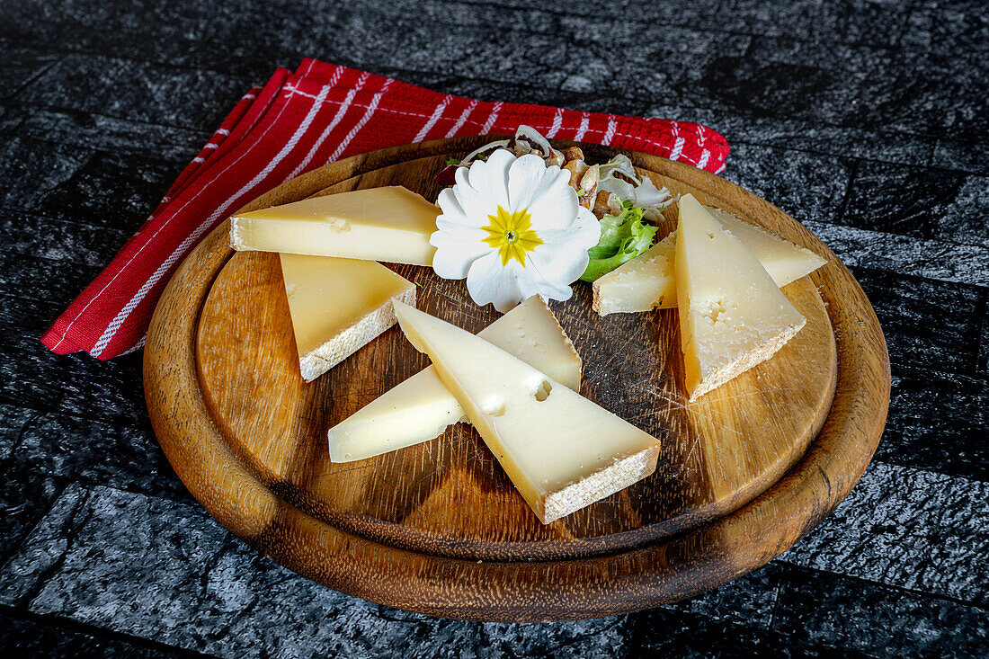 Selection of typical italian cheese in wood chopping board